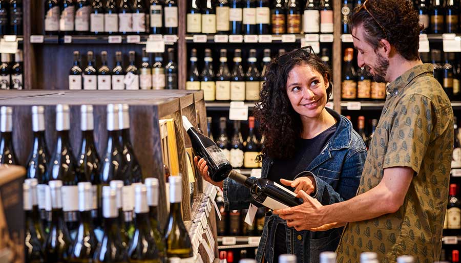 Customers looking at wine labels