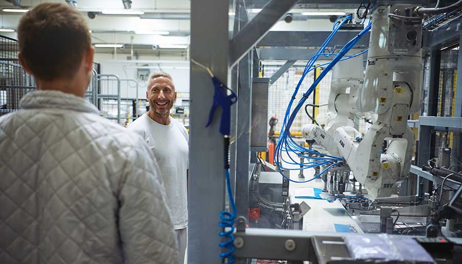 Two men smiling in production