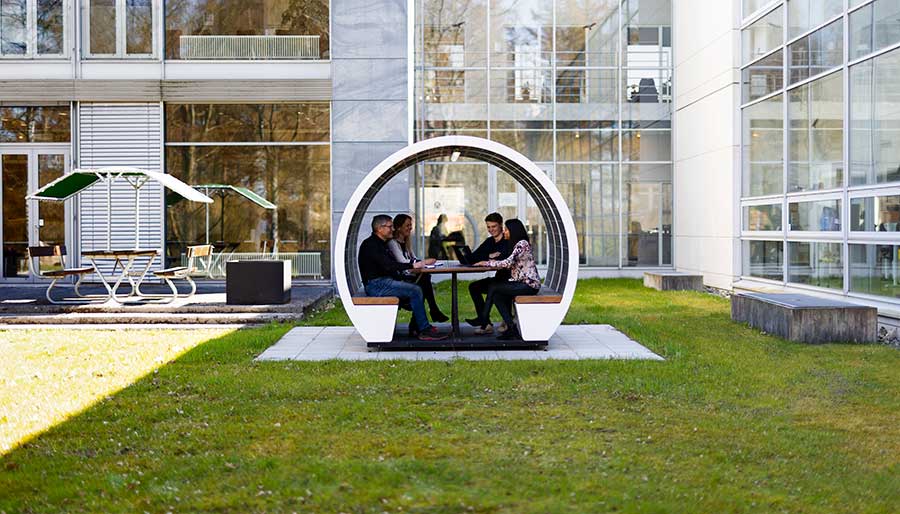 Employees in the pod outside