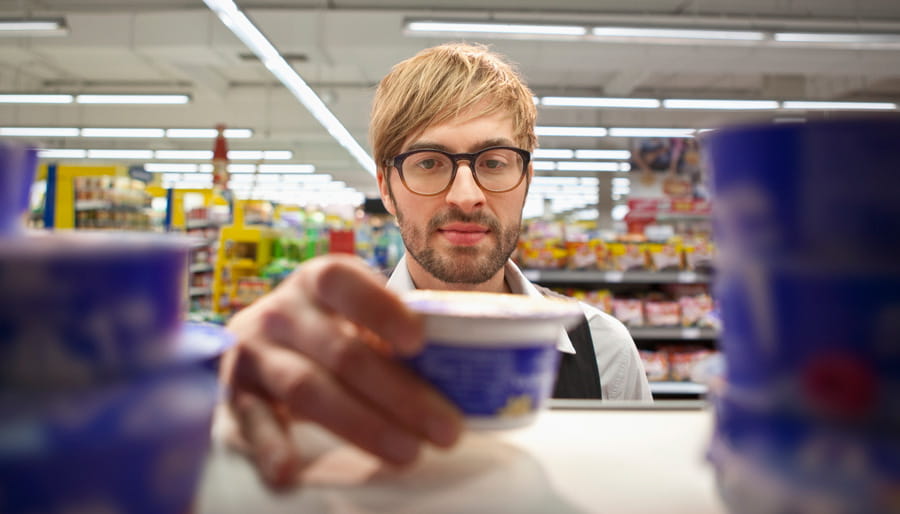 Man taking product from shelf