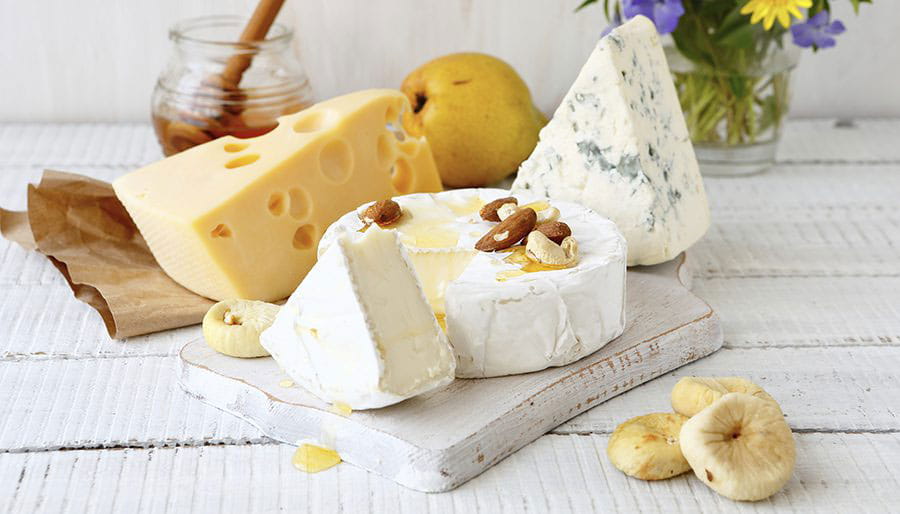 Assorted cheeses with honey and lemon