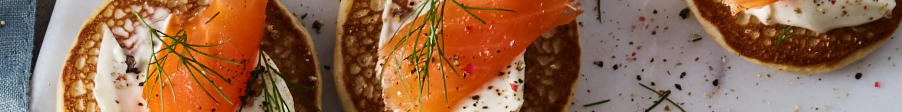 Smoked salmon on blinis with cream cheese