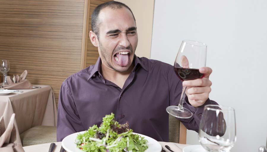 Man frowning at wine