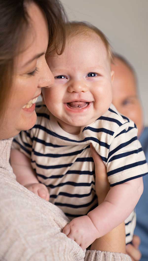 Smiling-baby-infant-with-mother