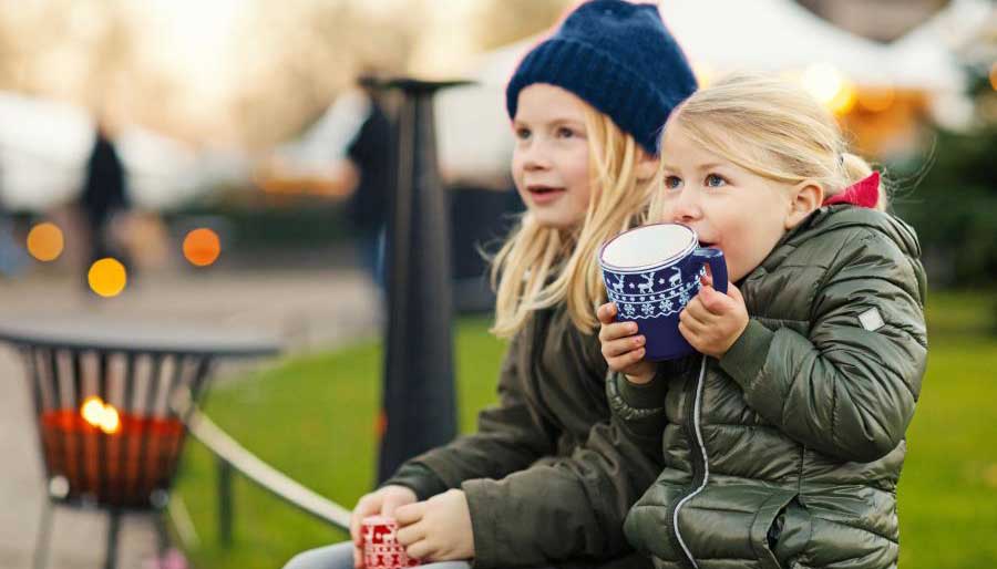Kids outside drinking hot chocolate