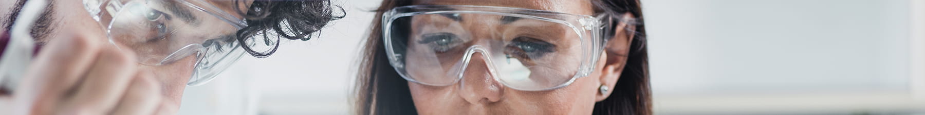 Scientists with protective glasses